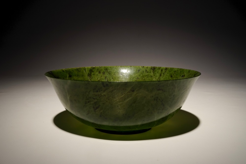 A Chinese thin-walled spinach green jade bowl, 20th C.